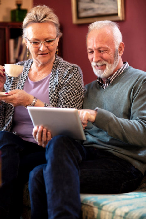 senior couple on tablet